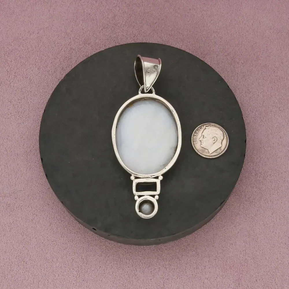 sterling silver topaz & carved mother of pearl silhouette pendant
